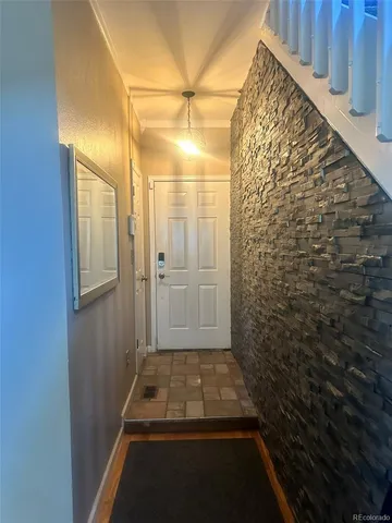 a kitchen that has a table and chair in it