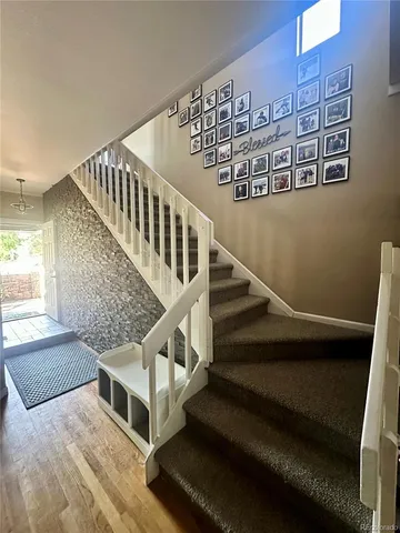 a kitchen with stainless steel appliances granite countertop a stove refrigerator sink microwave and cabinets