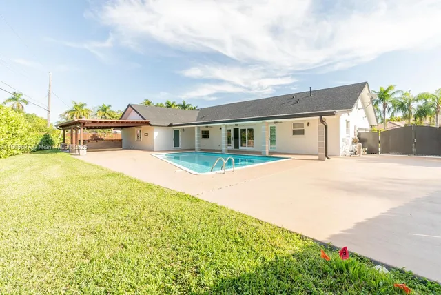 a view of a house with a swimming pool