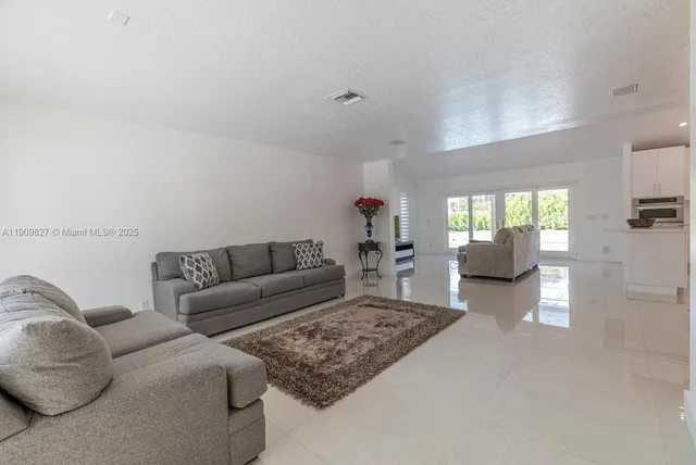 a living room with furniture and a couch
