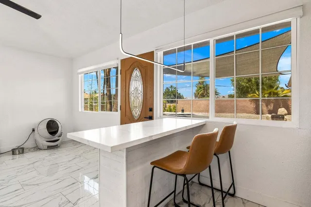 a view of a dining table and chair in a room