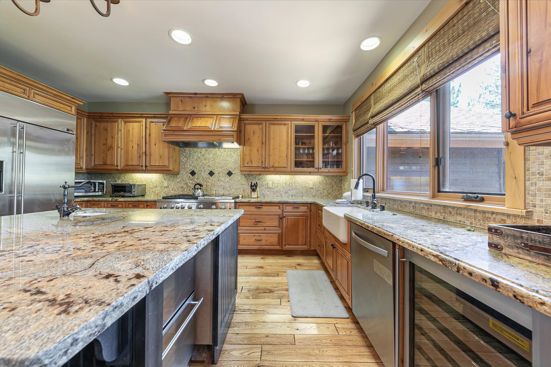 10243 Valmont Trail Truckee, CA 96161 - Photo 11 of 28 a large kitchen with granite countertop a sink and a stove