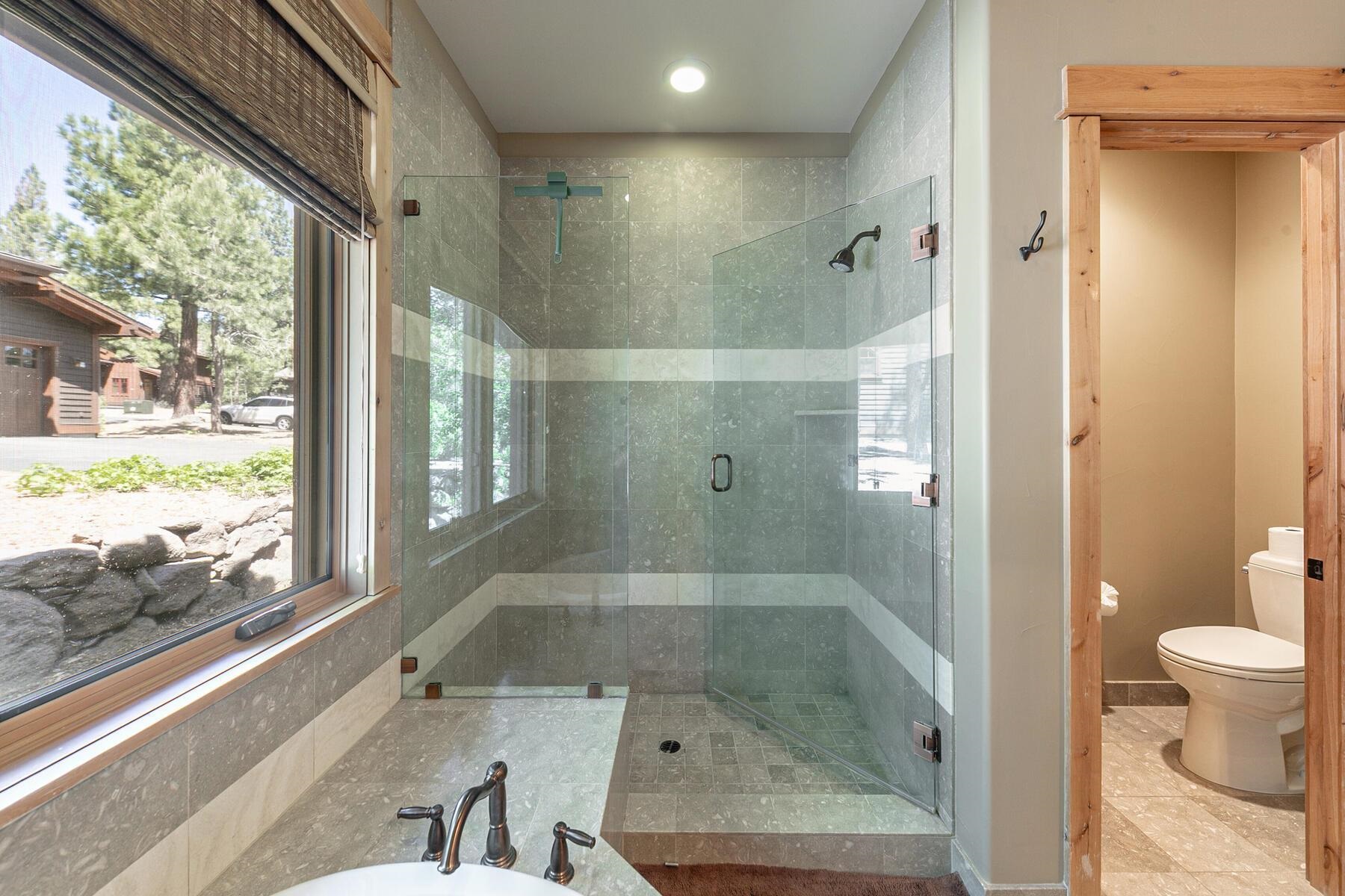 10243 Valmont Trail Truckee, CA 96161 - Photo 15 of 28 a bathroom with a bathtub and a shower