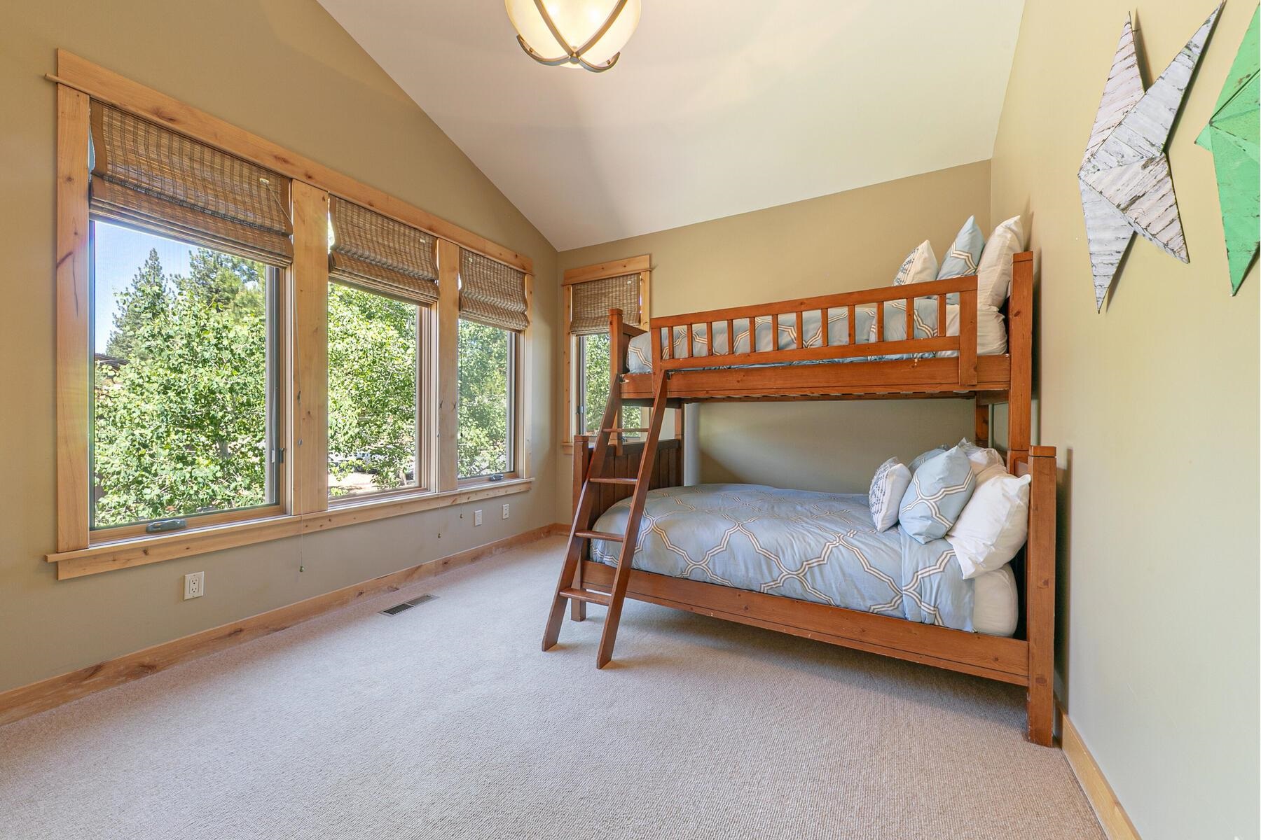 10243 Valmont Trail Truckee, CA 96161 - Photo 16 of 28 a bedroom with a bed and a window