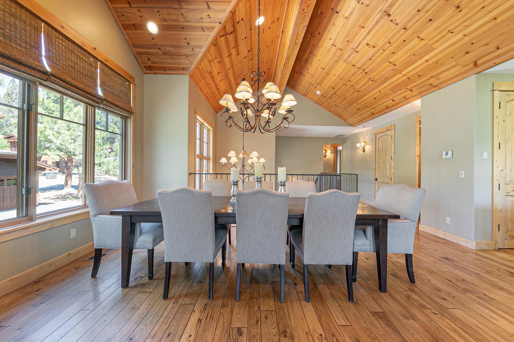 10243 Valmont Trail Truckee, CA 96161 - Photo 8 of 28 a view of a dining room with furniture wooden floor and chandelier