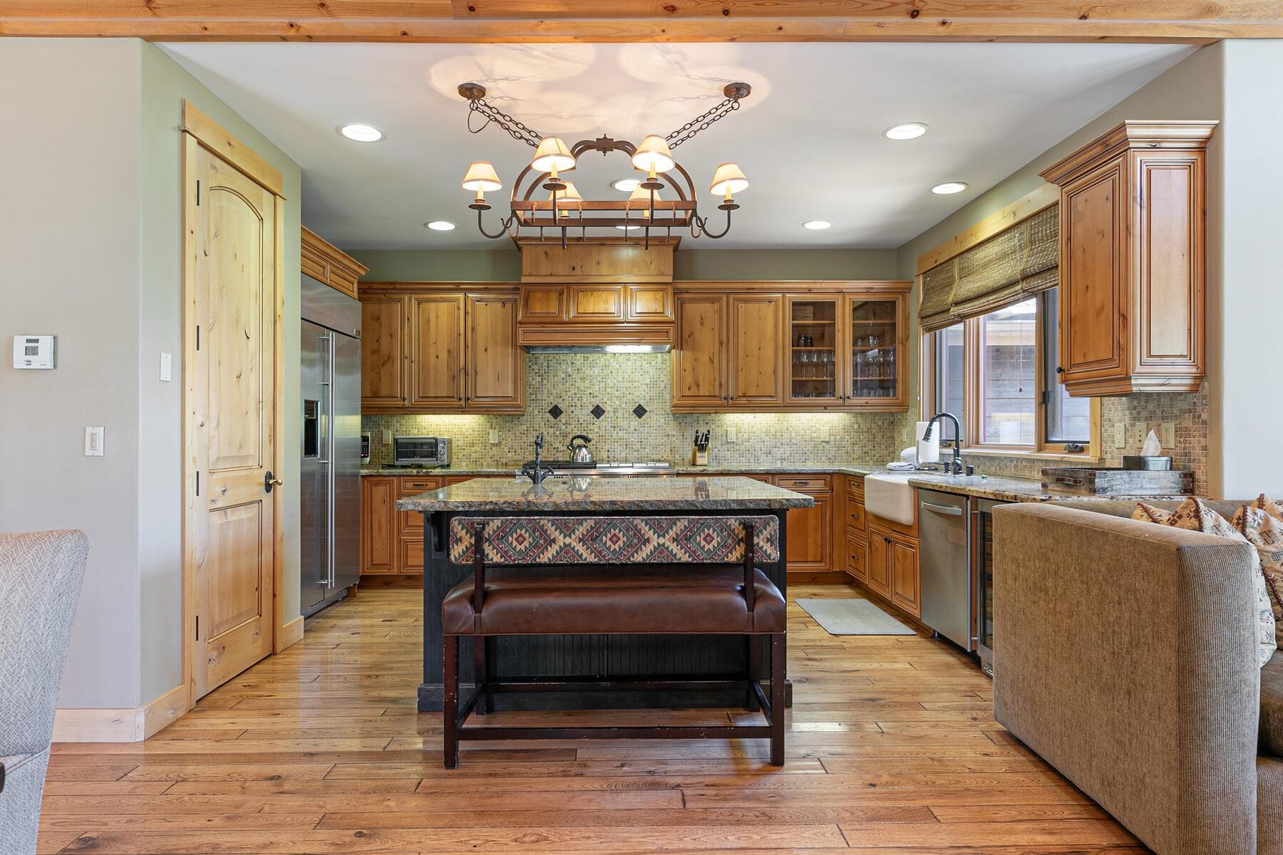 10243 Valmont Trail Truckee, CA 96161 - Photo 10 of 28 a kitchen with granite countertop a stove and cabinets