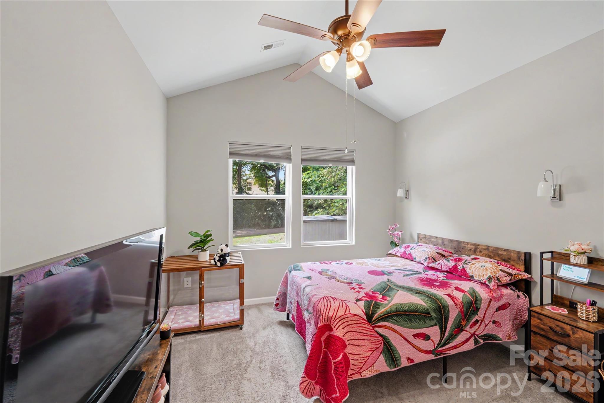 119 Brown Street Clover, SC 29710 - Photo 16 of 24 a bedroom with a bed and a chandelier