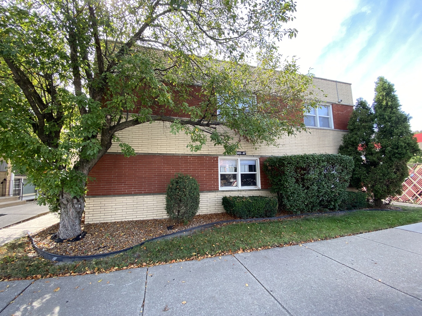 4345 West 63rd Street, Unit 2D Chicago, IL 60629 - Photo 1 of 12 a front view of a house with garden