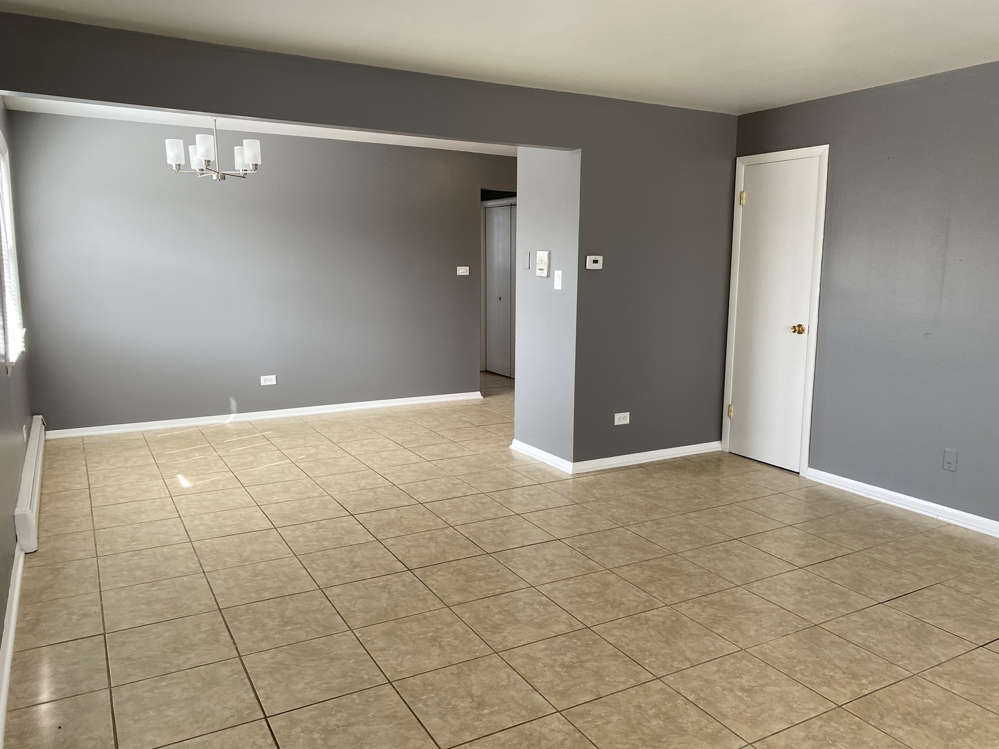 4345 West 63rd Street, Unit 2D Chicago, IL 60629 - Photo 4 of 12 a view of a livingroom with an empty space