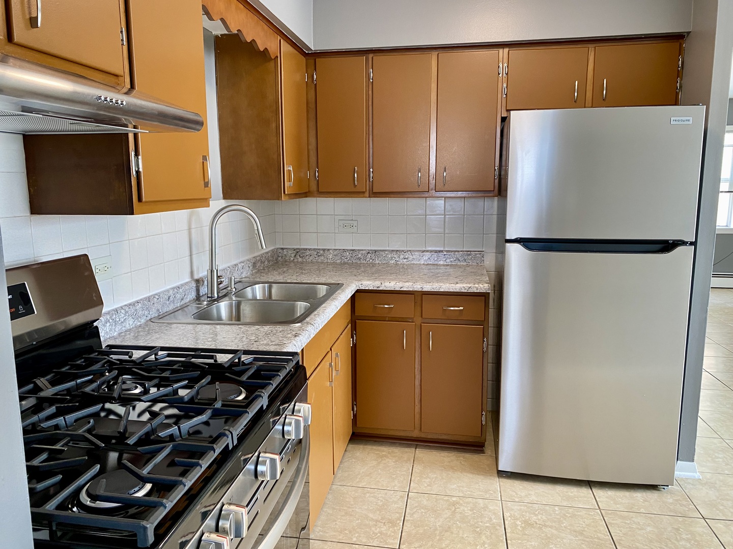 4345 West 63rd Street, Unit 2D Chicago, IL 60629 - Photo 5 of 12 a kitchen with a refrigerator and a sink