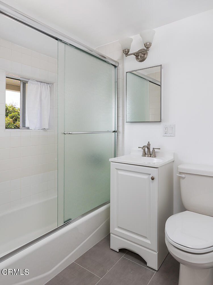 964 Atchison Street, Unit C Pasadena, CA 91104 - Photo 13 of 15 a bathroom with a sink toilet and shower