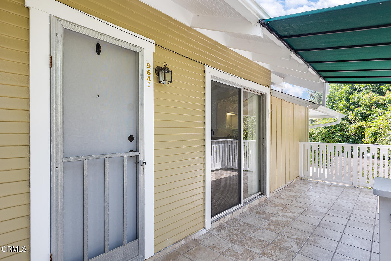 964 Atchison Street, Unit C Pasadena, CA 91104 - Photo 4 of 15 a view of a porch with a door and wooden floor