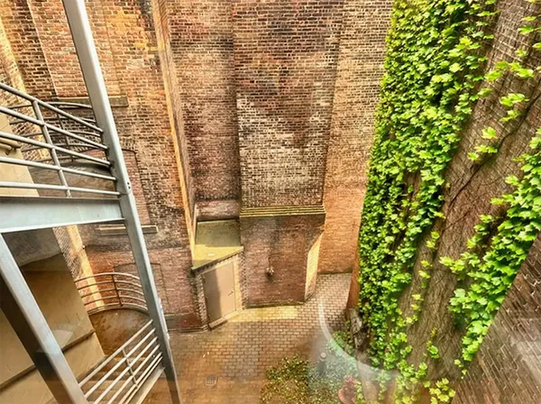 a bedroom with a bed and a mirror