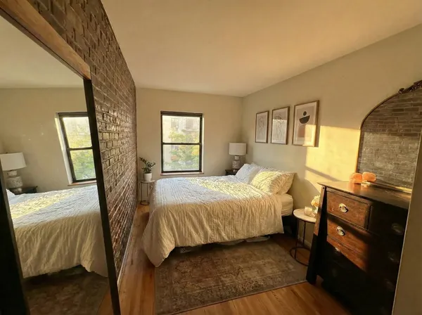 a street sign on a wall next to a building