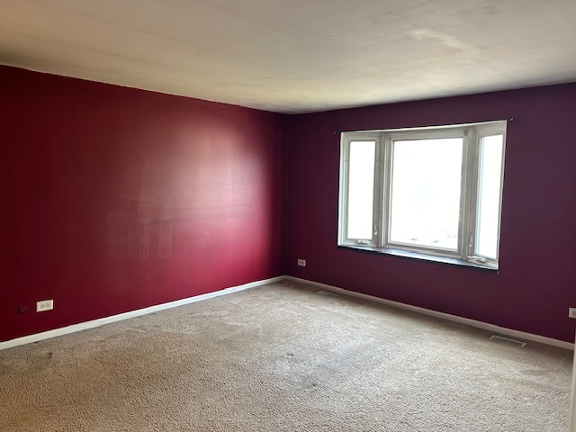 2093 Kettering Road Hoffman Estates, IL 60169 - Photo 14 of 28 an empty room with windows
