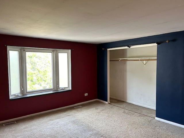 2093 Kettering Road Hoffman Estates, IL 60169 - Photo 15 of 28 an empty room with windows