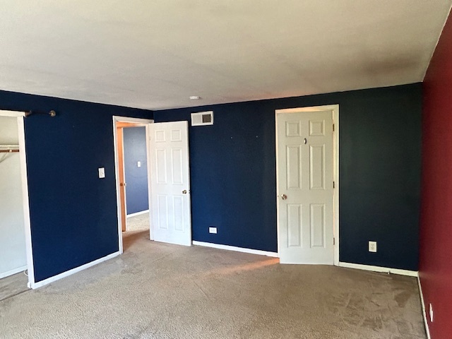 2093 Kettering Road Hoffman Estates, IL 60169 - Photo 16 of 28 an empty room with closet and windows