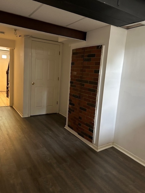 2093 Kettering Road Hoffman Estates, IL 60169 - Photo 24 of 28 a view of an empty room with wooden floor and door