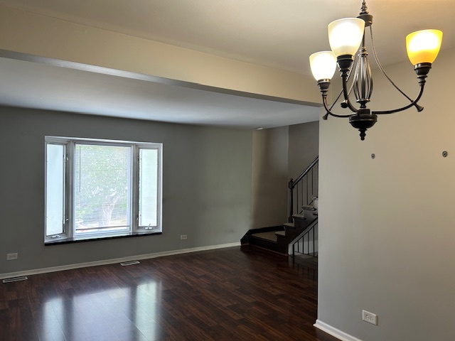 2093 Kettering Road Hoffman Estates, IL 60169 - Photo 6 of 28 a view of a room with wooden floor fan and windows