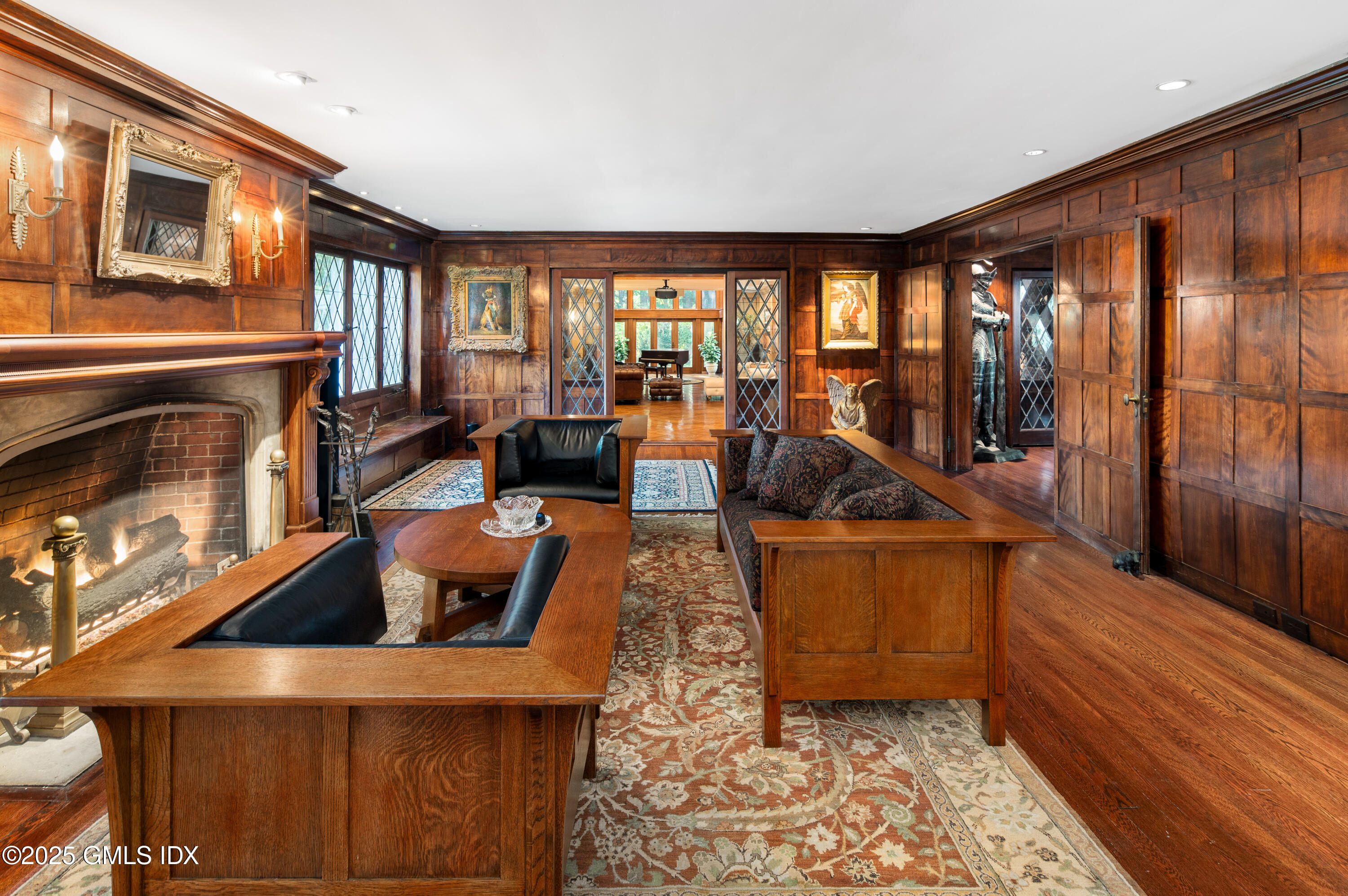 214 Good Hill Road Weston, CT 06883 - Photo 11 of 80 a living room with furniture and a fireplace
