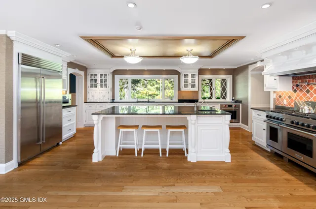 a bathroom with a sink mirror and toilet