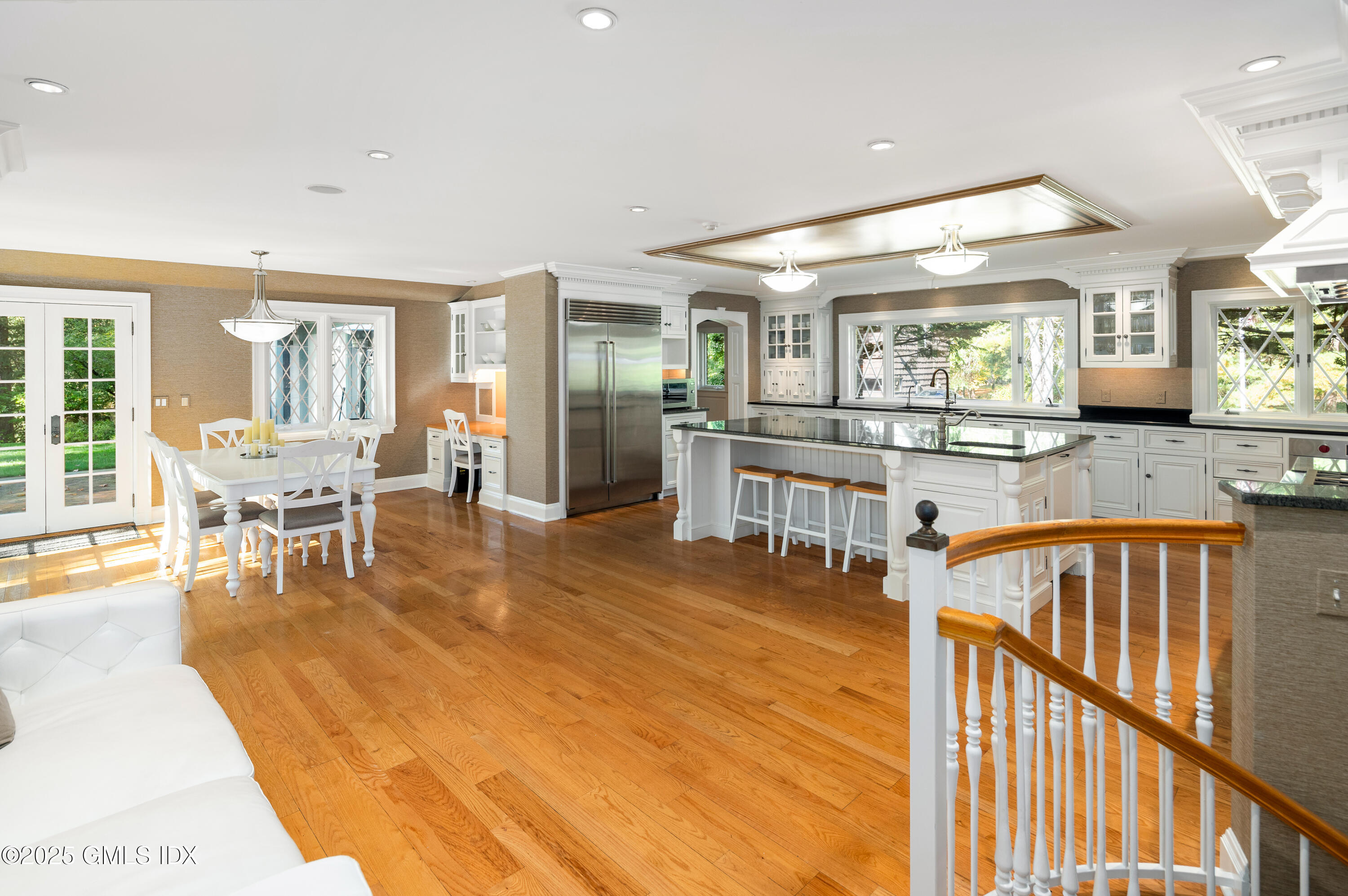 214 Good Hill Road Weston, CT 06883 - Photo 25 of 80 a dining hall with stainless steel appliances kitchen island granite countertop a dining table chairs and view living room