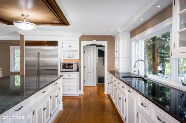 a view of a workspace with furniture and lounge chair