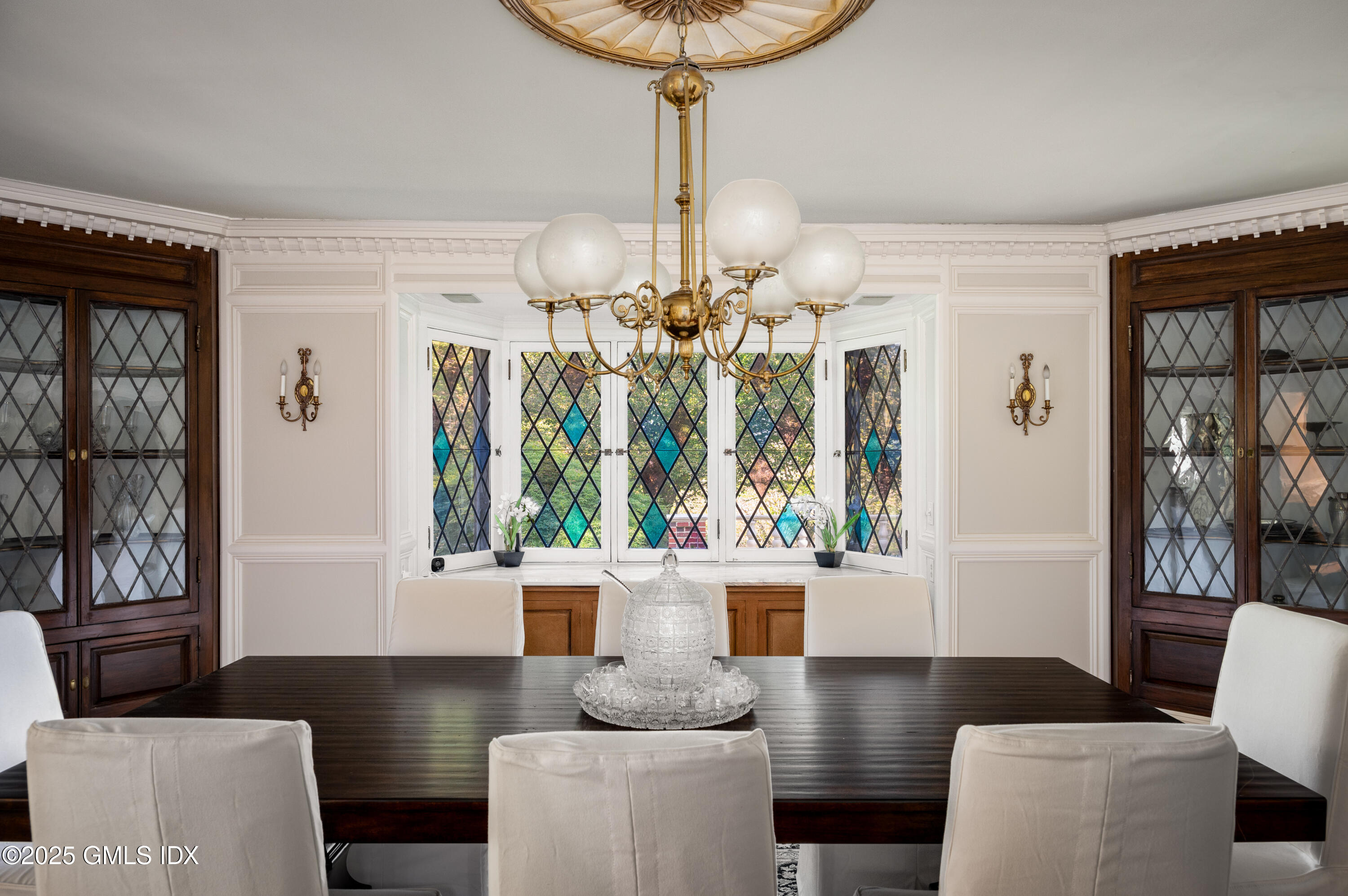 214 Good Hill Road Weston, CT 06883 - Photo 28 of 80 a living room with furniture and a chandelier