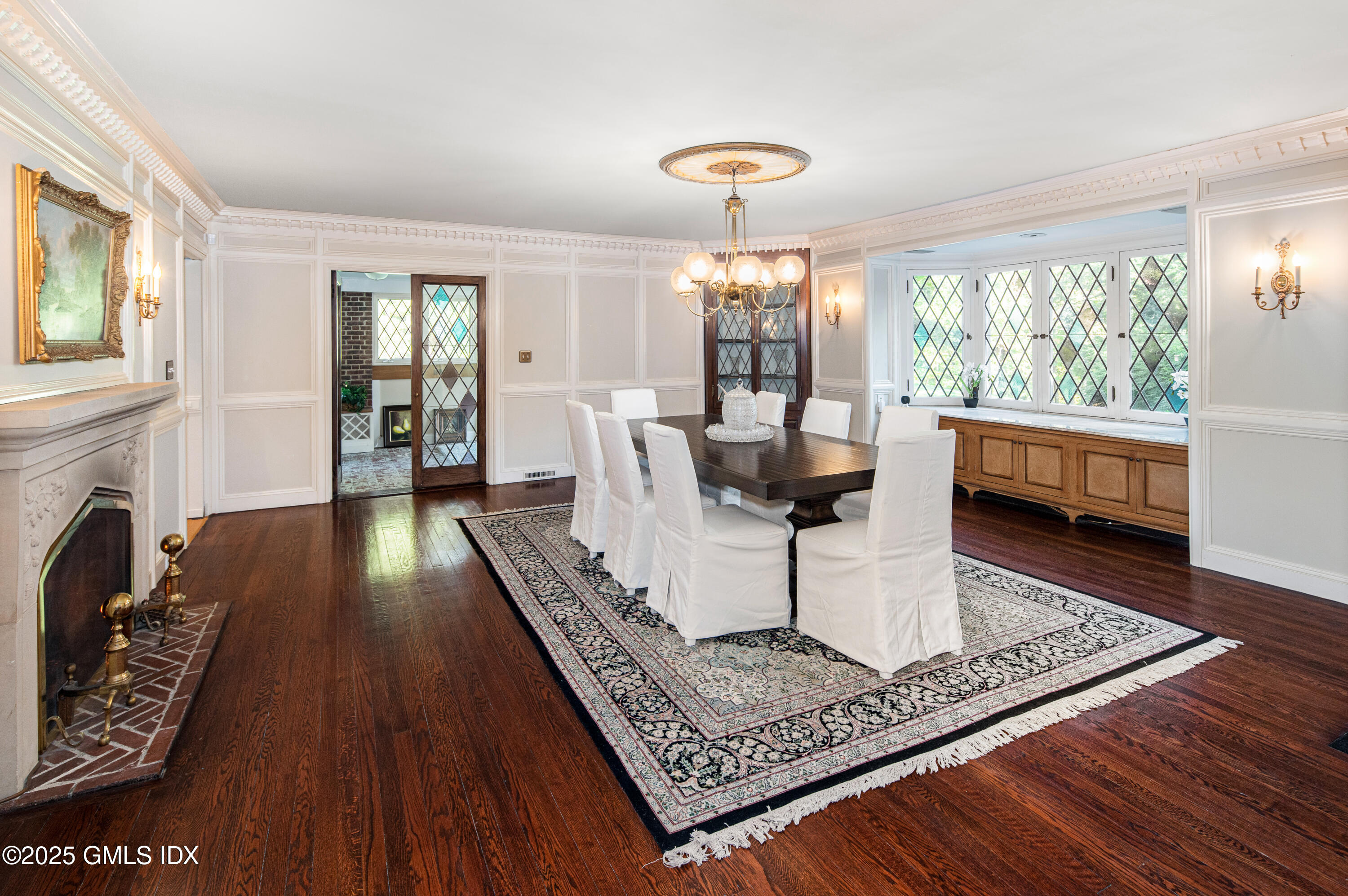 214 Good Hill Road Weston, CT 06883 - Photo 30 of 80 a living room with furniture and a fireplace