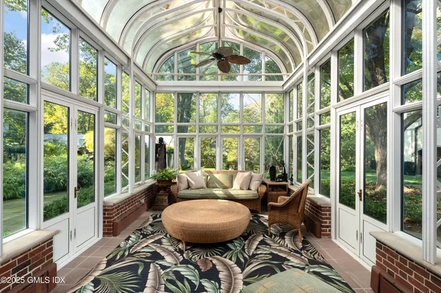 a bed sitting in a room next to a window