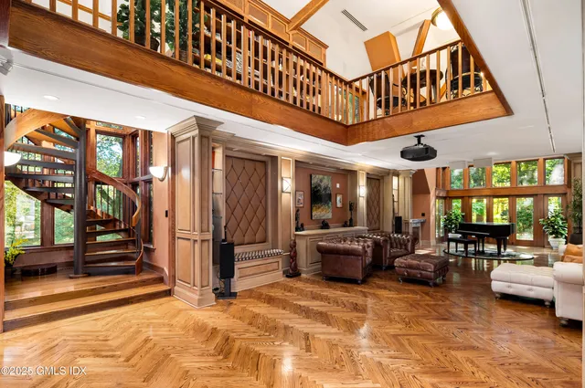 a spacious bedroom with a bed and a shower