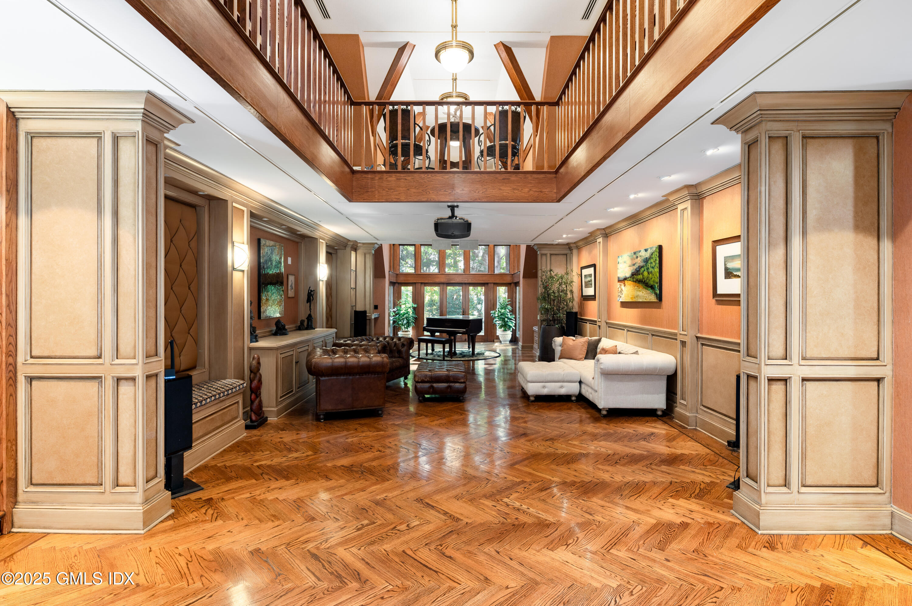 214 Good Hill Road Weston, CT 06883 - Photo 36 of 80 a living room with furniture a chandelier and a dining table with wooden floor
