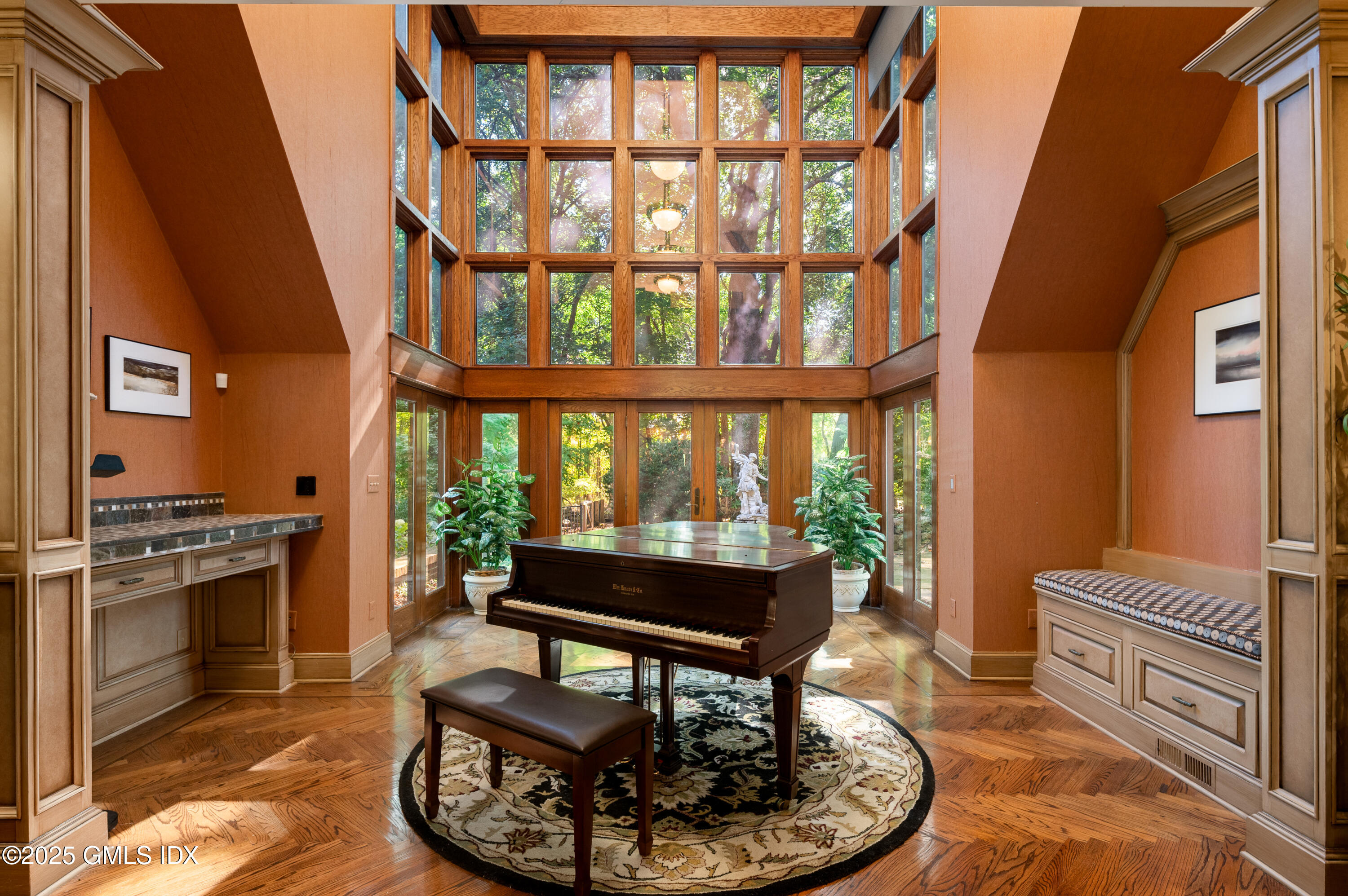 214 Good Hill Road Weston, CT 06883 - Photo 39 of 80 a living room with furniture a fireplace and a floor to ceiling window