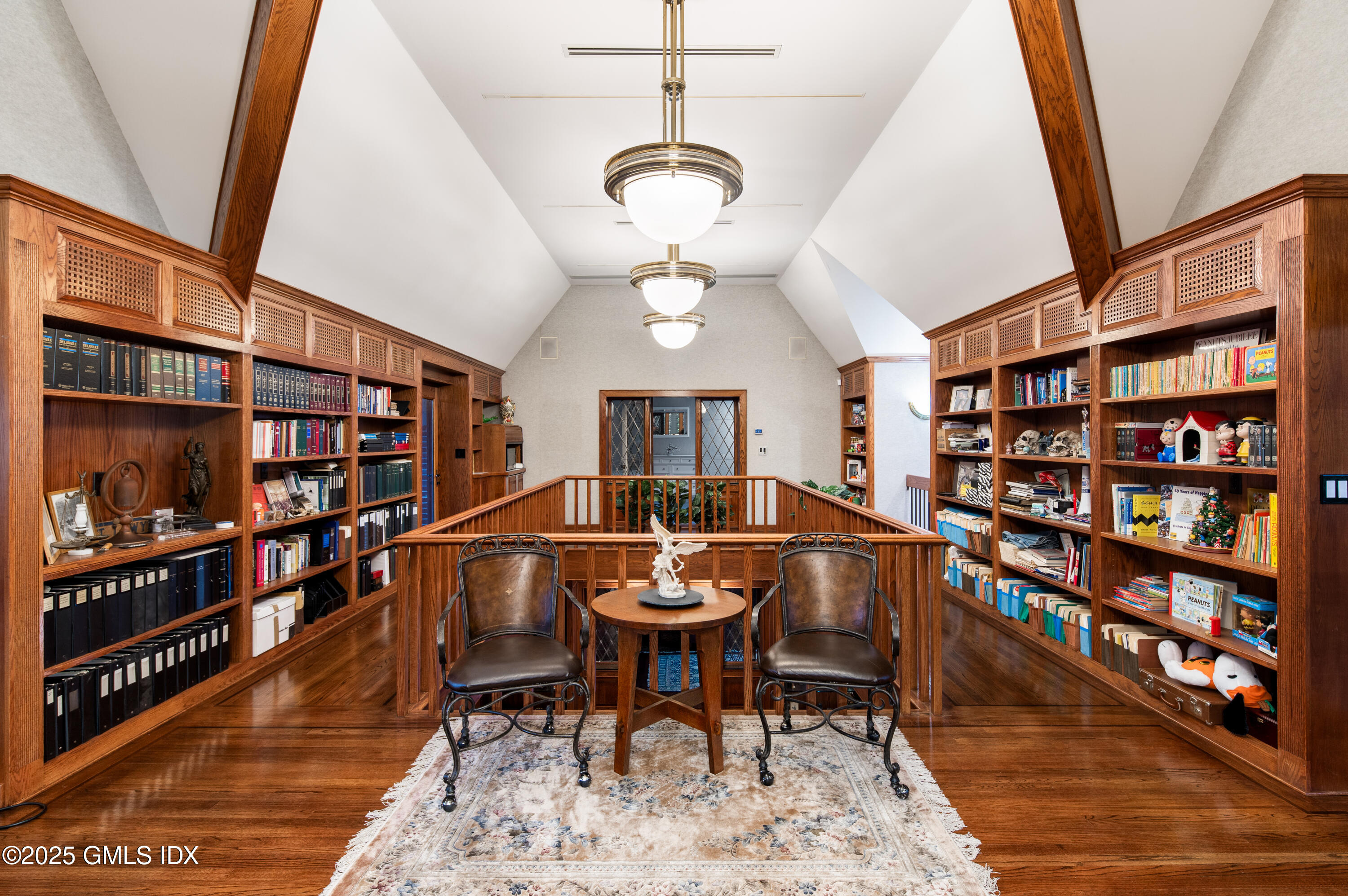 214 Good Hill Road Weston, CT 06883 - Photo 41 of 80 a living room with a furniture and a book shelf