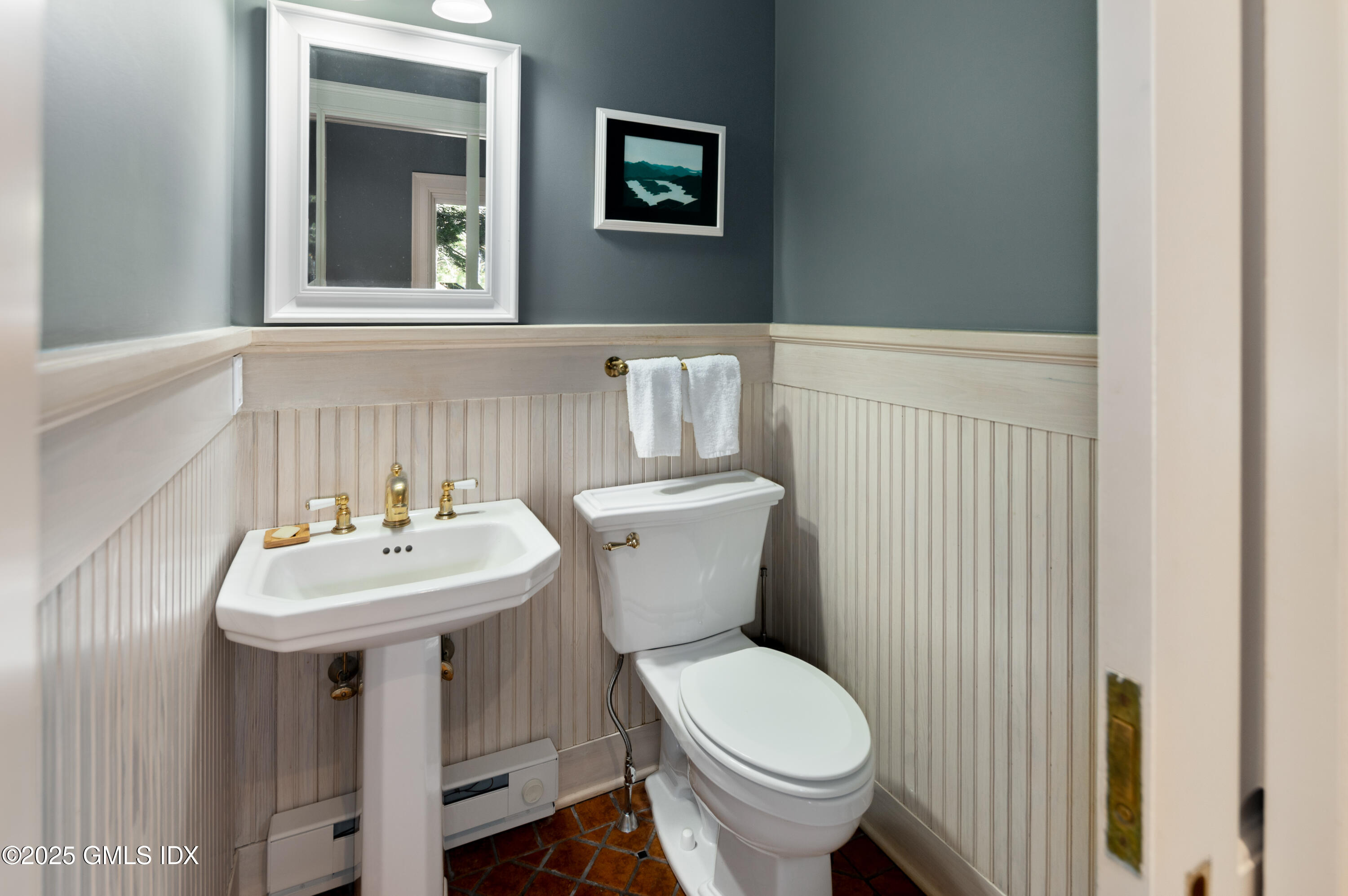 214 Good Hill Road Weston, CT 06883 - Photo 42 of 80 a bathroom with a sink mirror and toilet