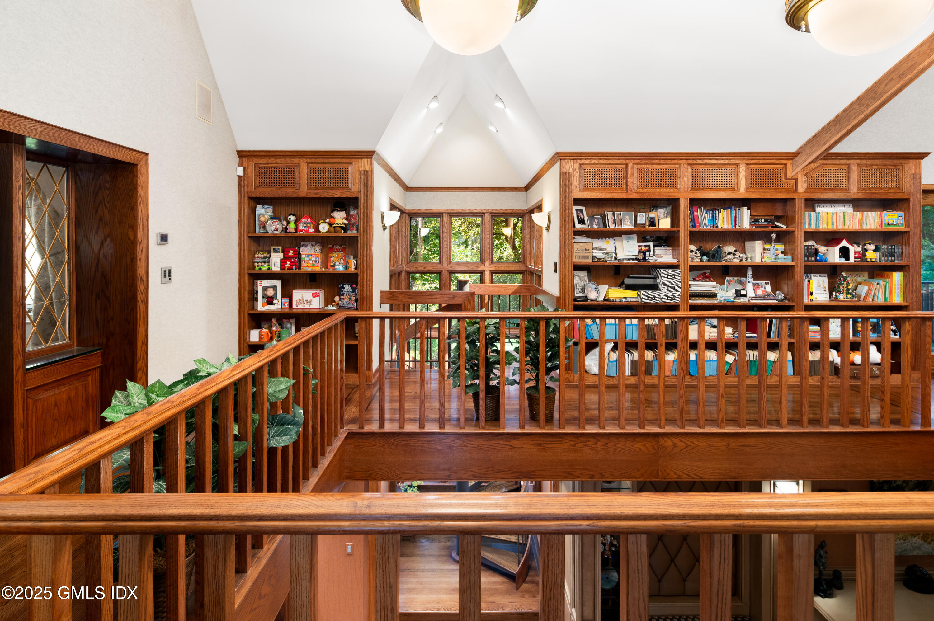 214 Good Hill Road Weston, CT 06883 - Photo 45 of 80 a view of staircase with lots of frames on wall and a large window