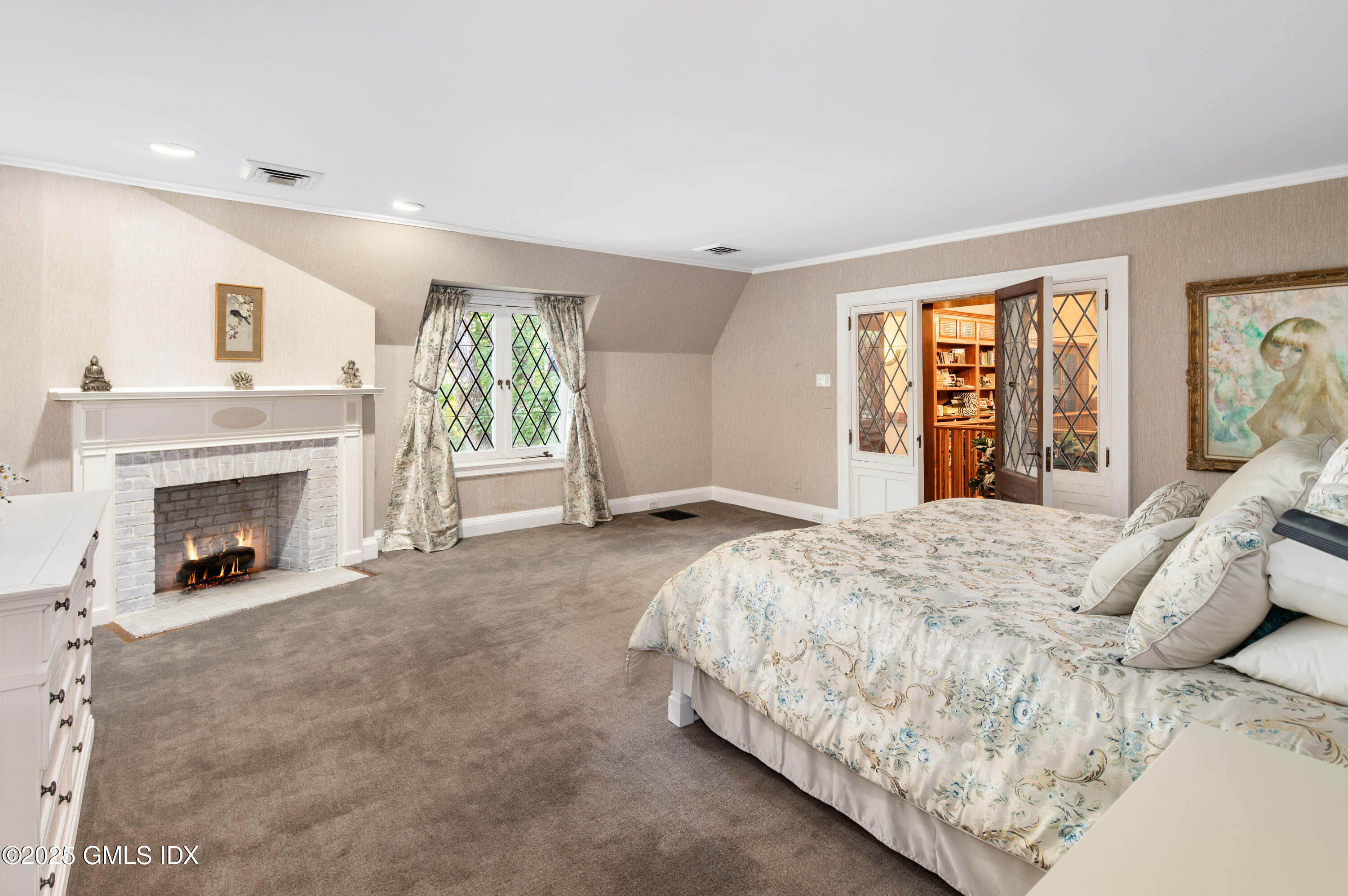 214 Good Hill Road Weston, CT 06883 - Photo 48 of 80 a spacious bedroom with a bed and a fireplace
