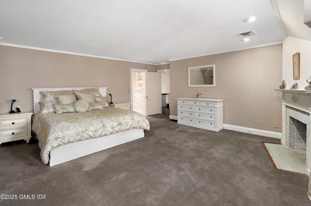 a backyard of a house with barbeque oven and outdoor seating