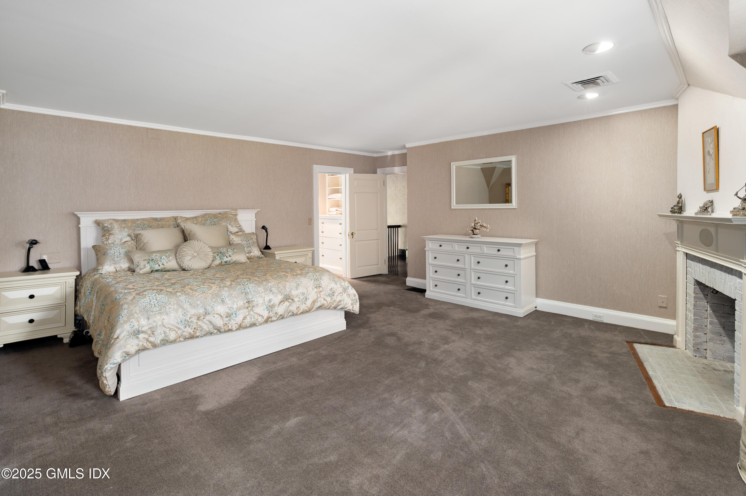 214 Good Hill Road Weston, CT 06883 - Photo 49 of 80 a spacious bedroom with a bed and a couch