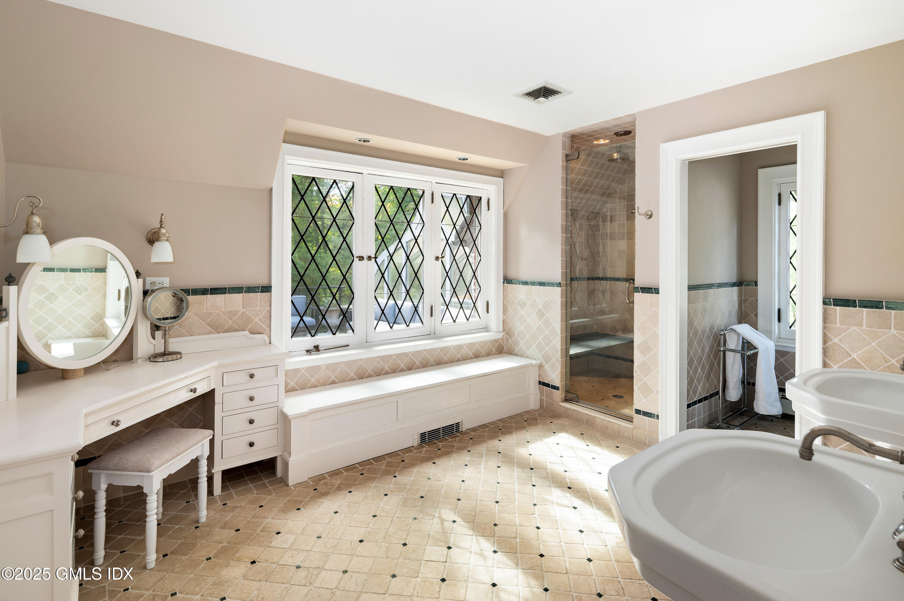 214 Good Hill Road Weston, CT 06883 - Photo 50 of 80 a bathroom with a tub sink and a large mirror