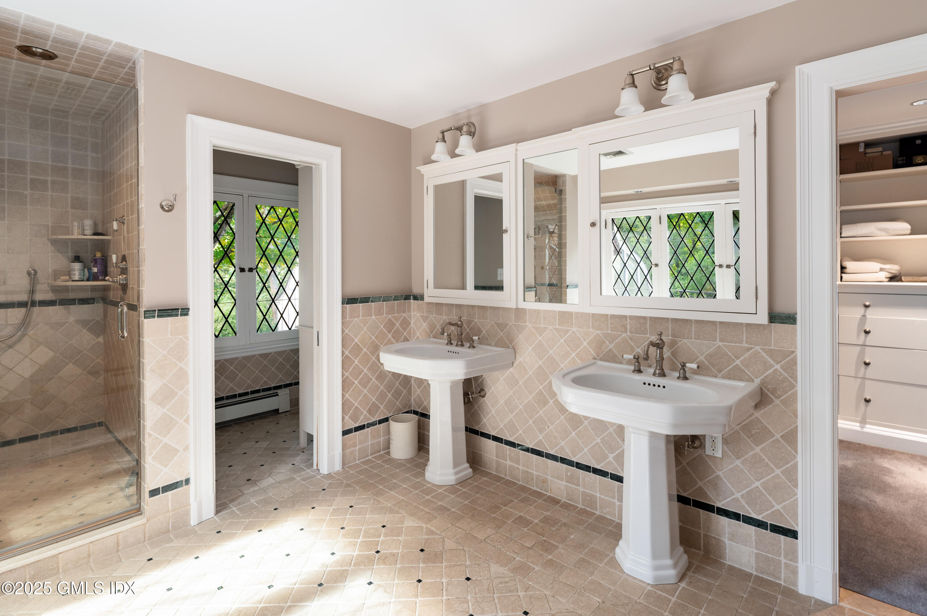 214 Good Hill Road Weston, CT 06883 - Photo 51 of 80 a bathroom with a sink and a mirror