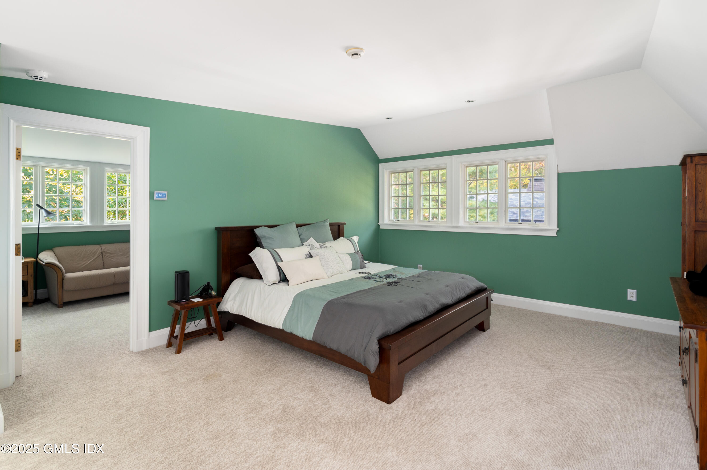 214 Good Hill Road Weston, CT 06883 - Photo 53 of 80 a bed sitting in a room next to a window