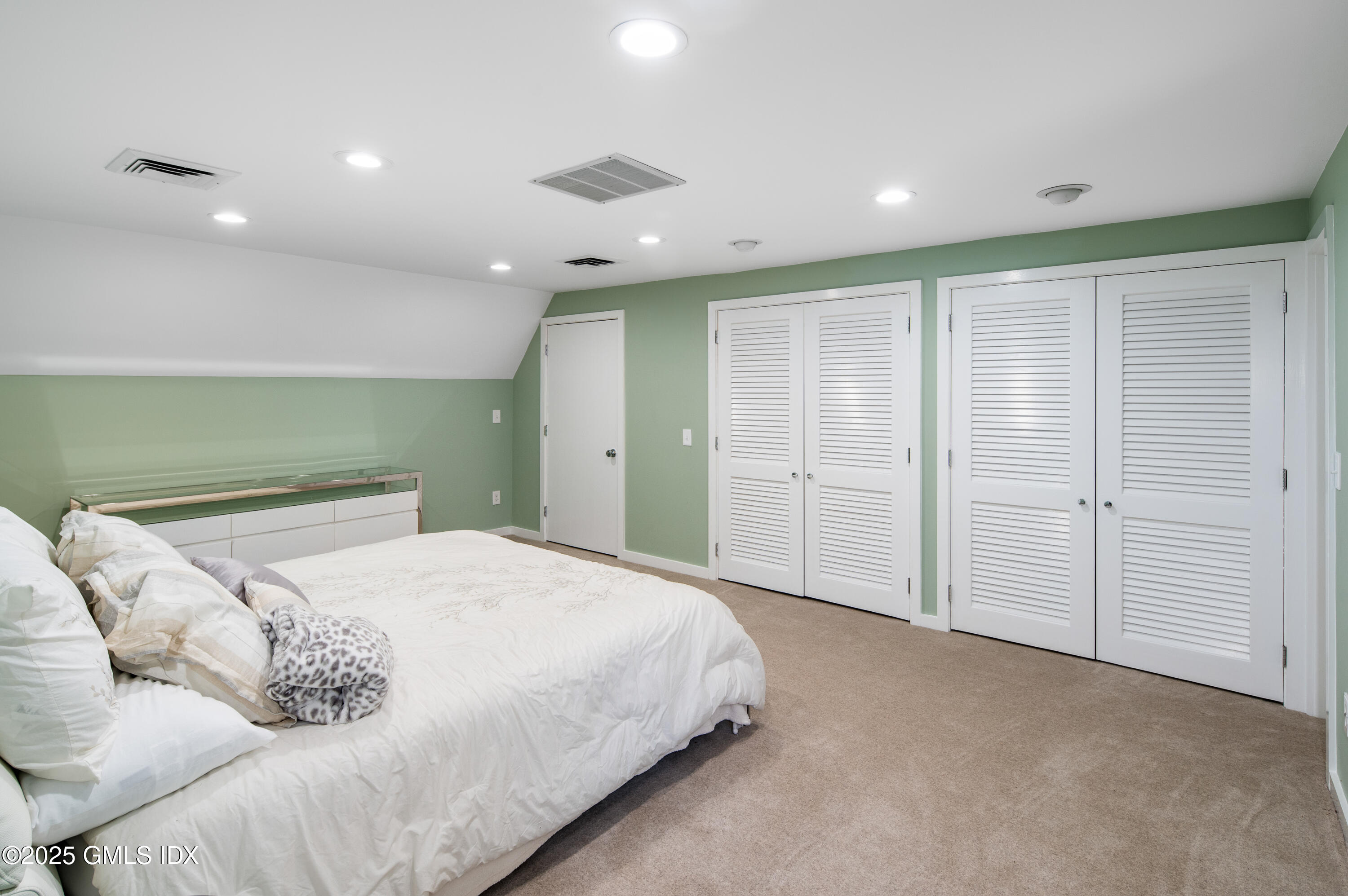 214 Good Hill Road Weston, CT 06883 - Photo 56 of 80 a spacious bedroom with a bed and a shower