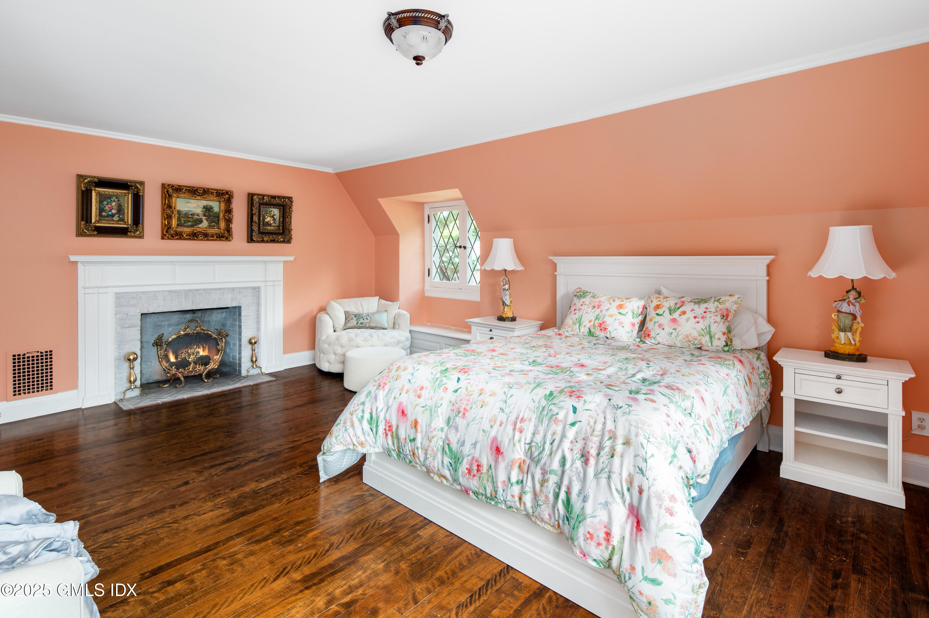 214 Good Hill Road Weston, CT 06883 - Photo 57 of 80 a bedroom with a bed and a fireplace