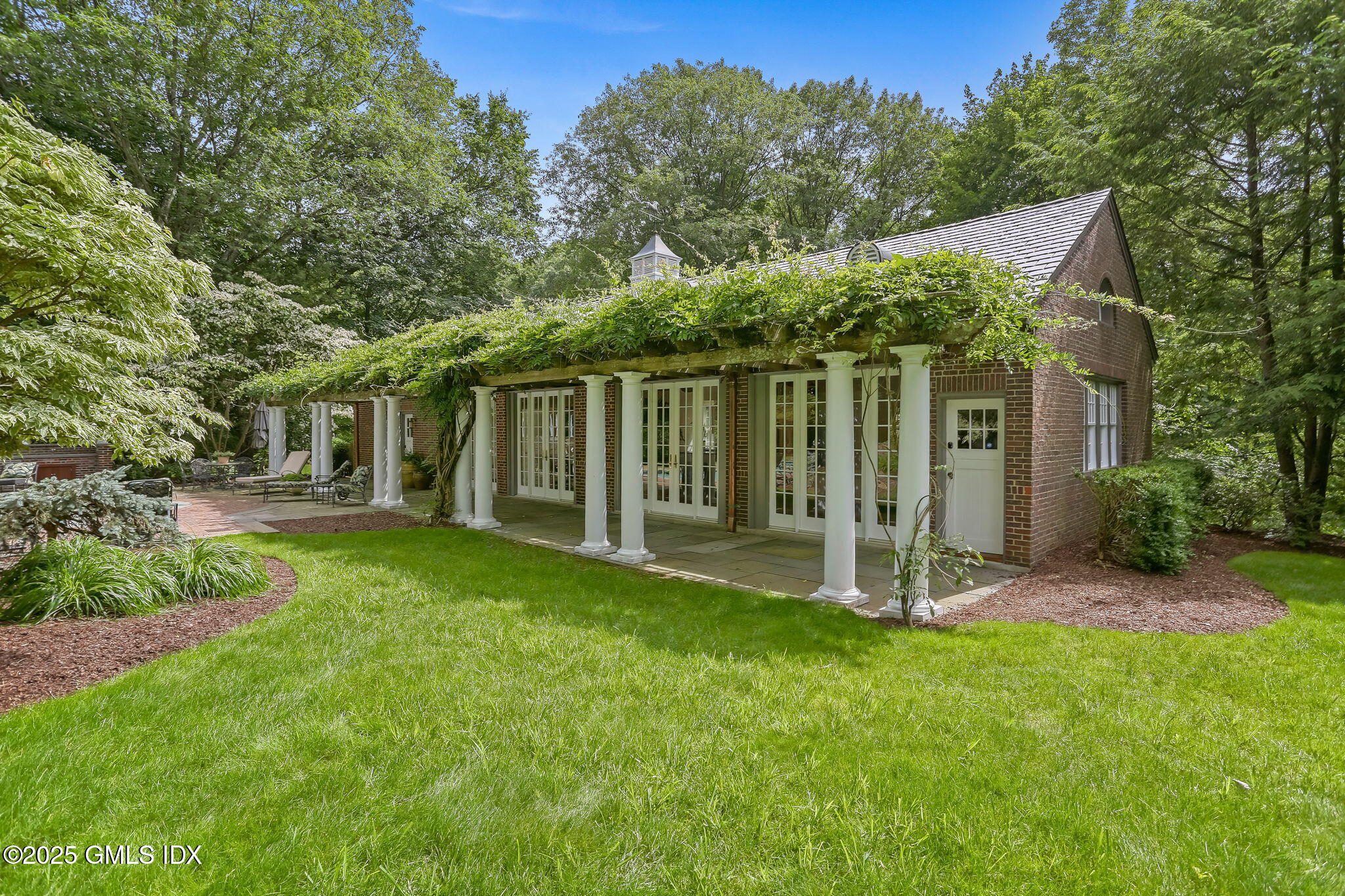 214 Good Hill Road Weston, CT 06883 - Photo 64 of 80 a view of a house with backyard and a garden