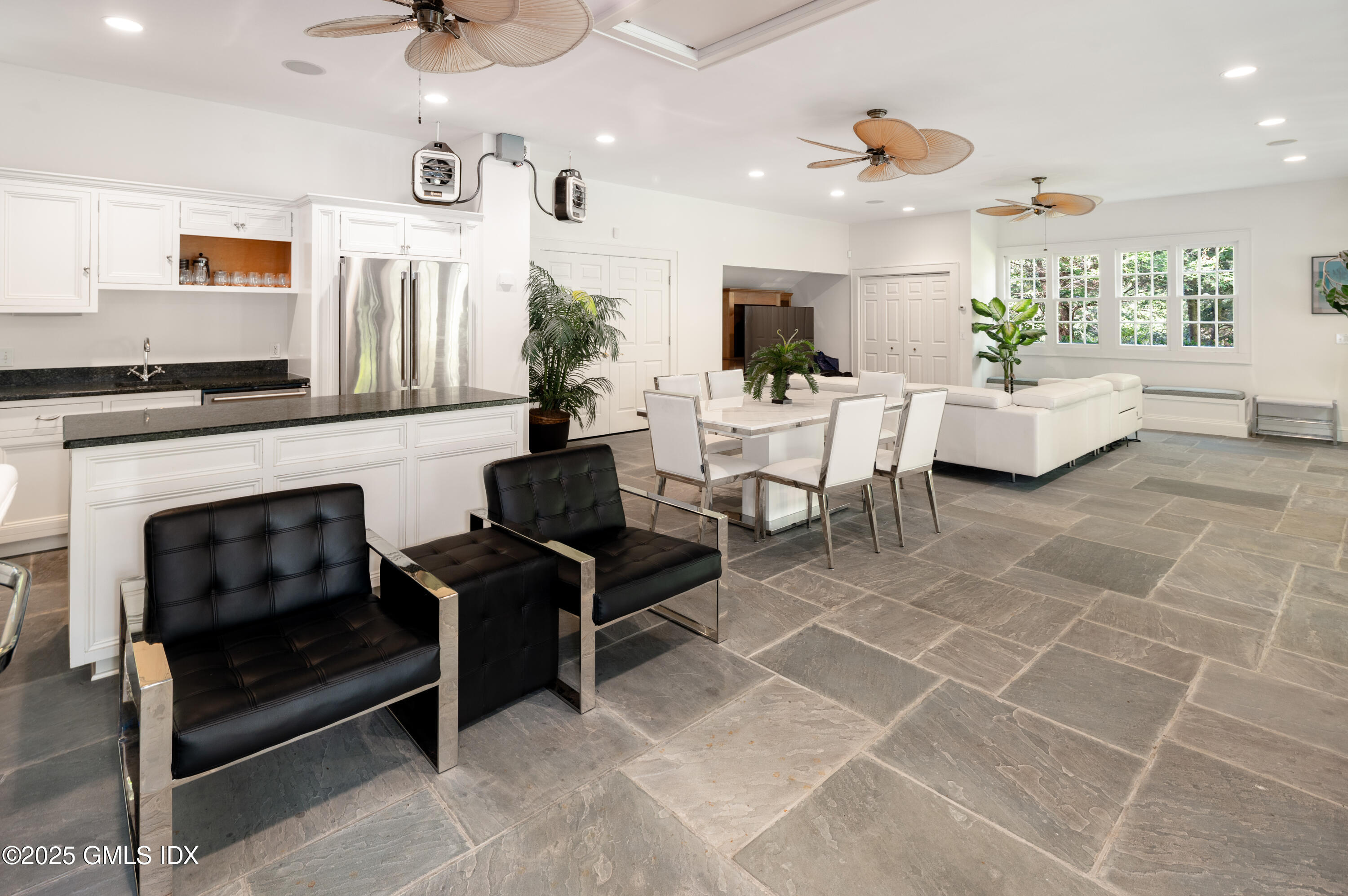 214 Good Hill Road Weston, CT 06883 - Photo 67 of 80 a living room with furniture a fireplace and a potted plant