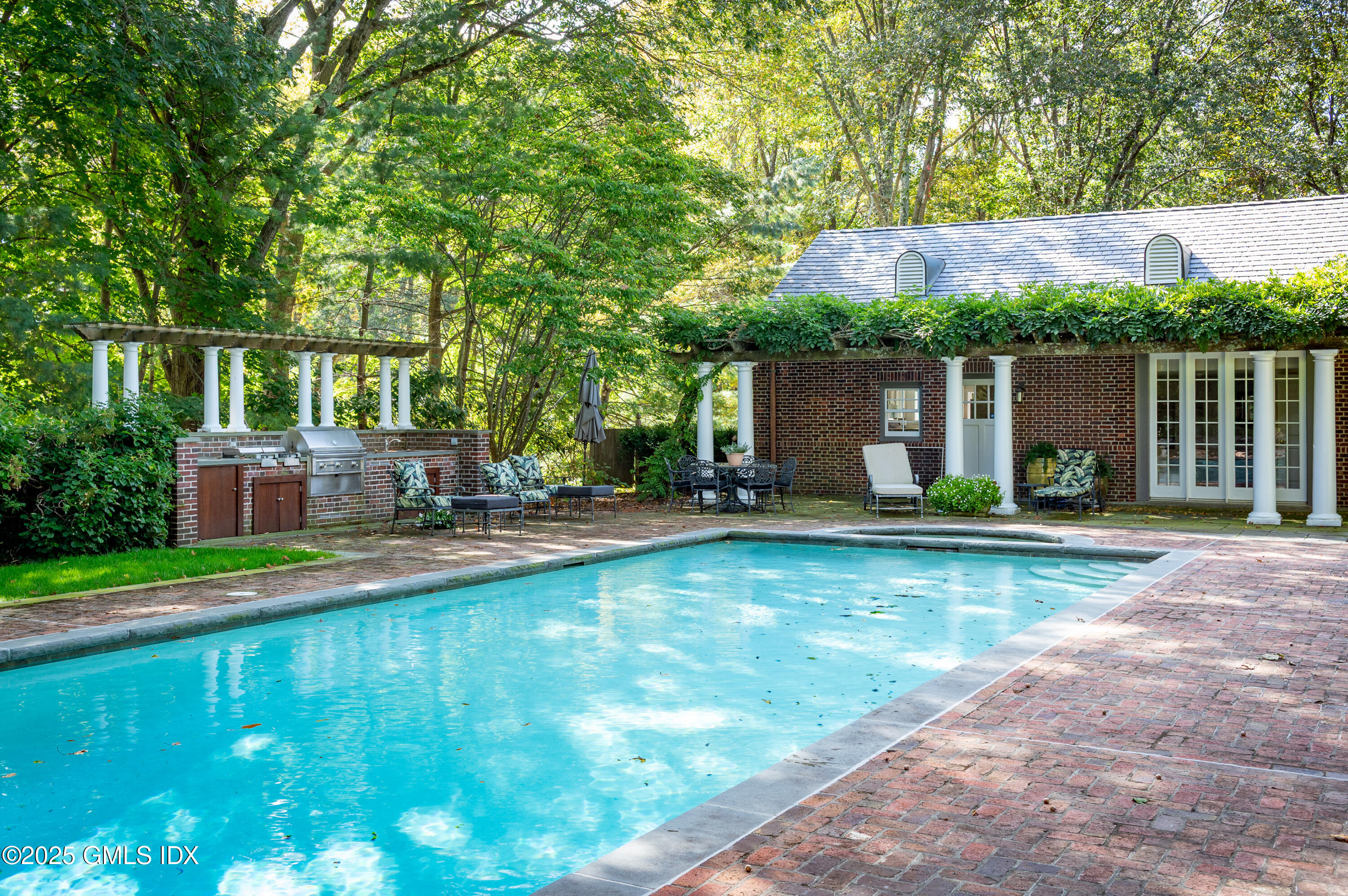 214 Good Hill Road Weston, CT 06883 - Photo 74 of 80 a front view of house with yard and outdoor seating