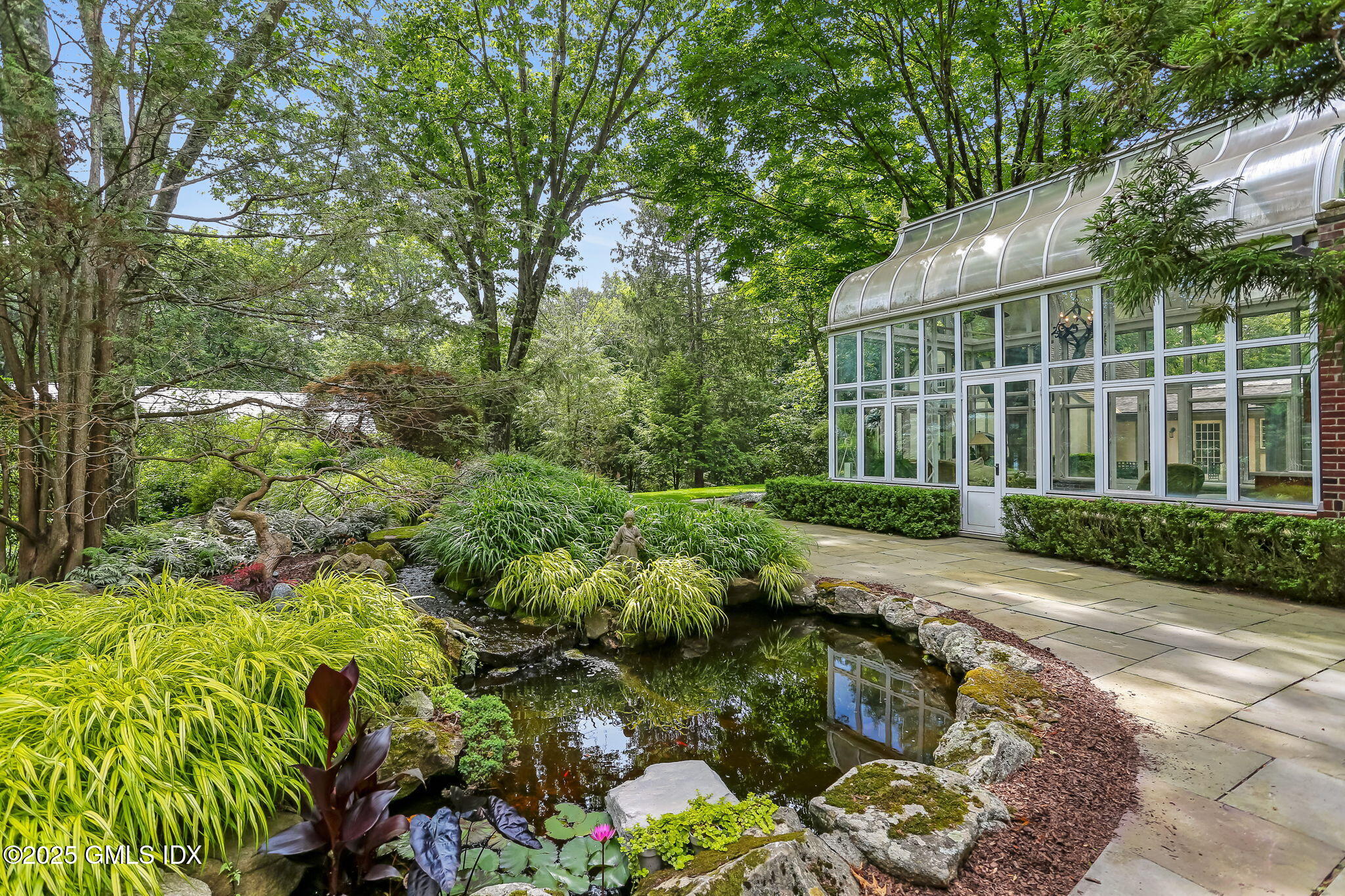 214 Good Hill Road Weston, CT 06883 - Photo 75 of 80 a view of a garden with plants