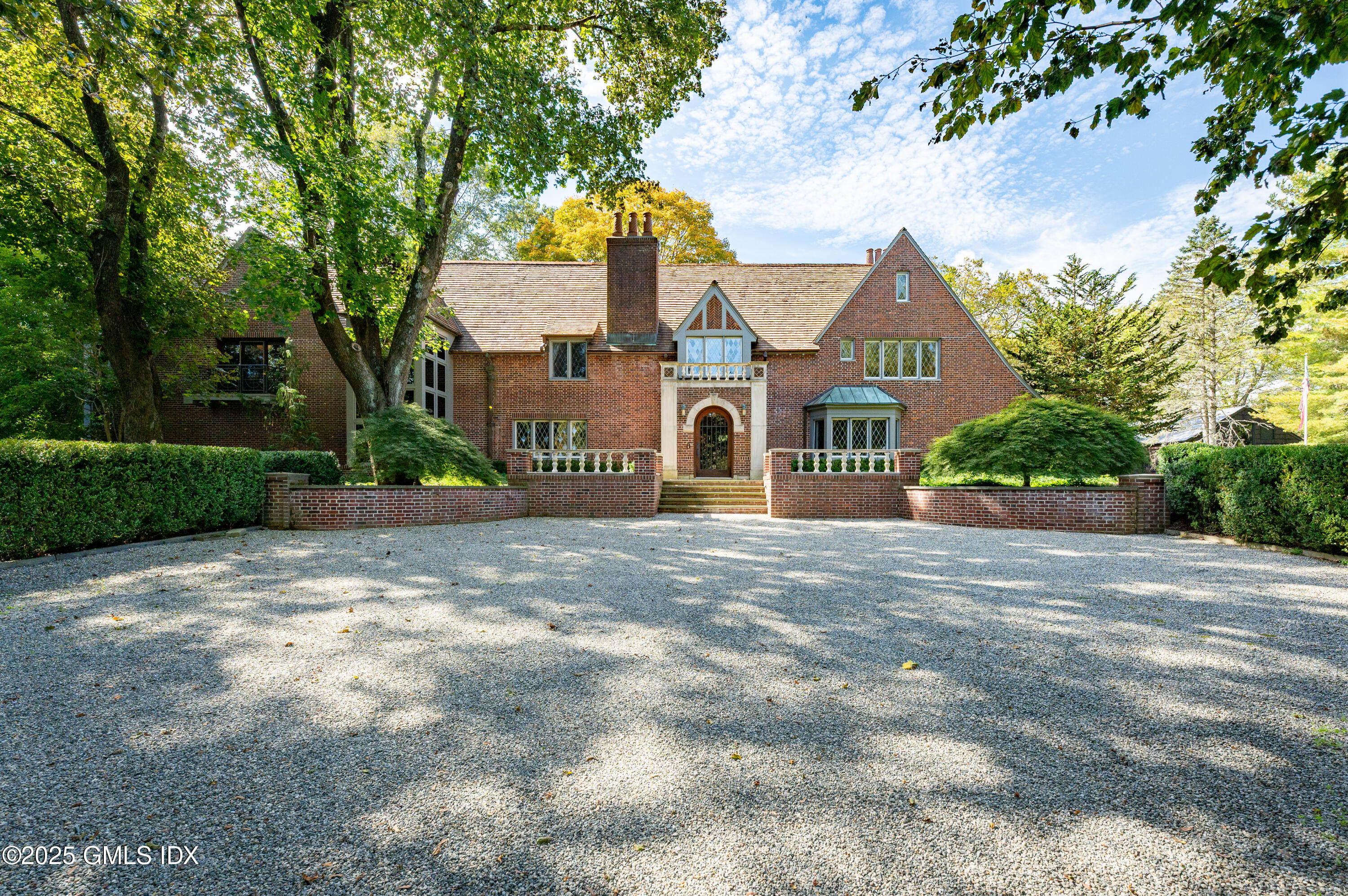 214 Good Hill Road Weston, CT 06883 - Photo 79 of 80 a view of a house with a yard and large trees