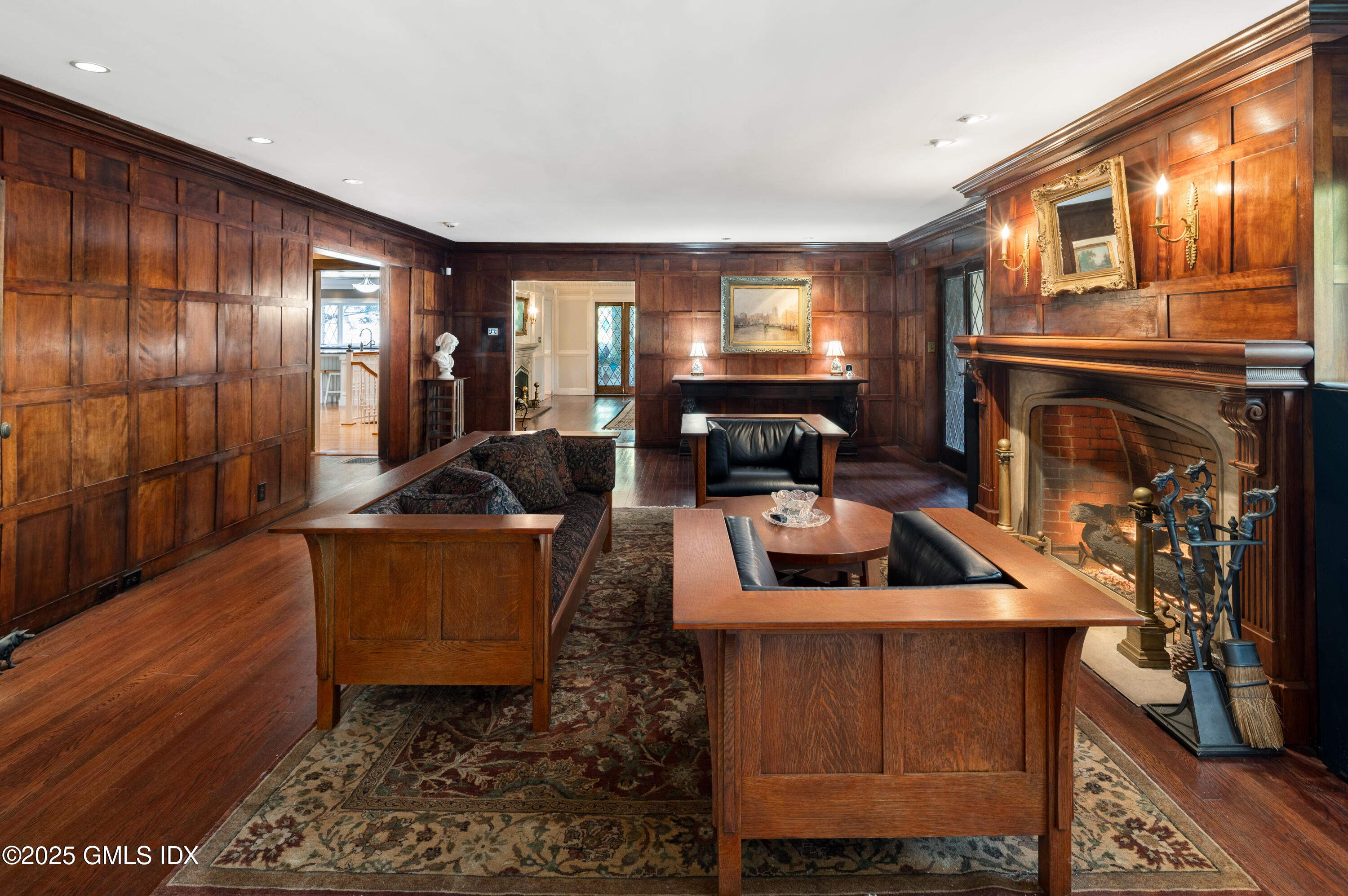 214 Good Hill Road Weston, CT 06883 - Photo 9 of 80 a living room with furniture a fireplace a rug and a window